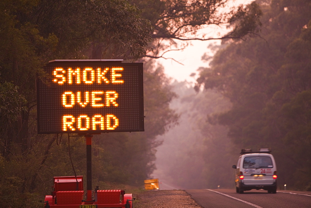 Smoke from bush fires over a dawn landscape near Orbost, New South Wales, Australia, Pacific