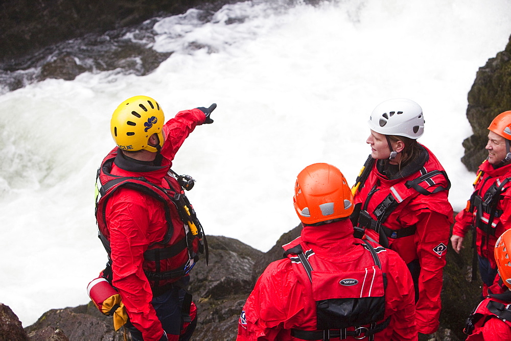 Members of the Langdale Ambleside Mountain Rescue Team train in Swift water rescue techniques on the River Brathay at Skelwyth, Lake District, Cumbria, England, United Kingdom, Europe