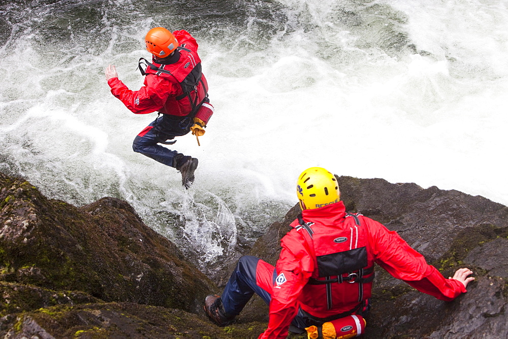 Members of the Langdale Ambleside Mountain Rescue Team train in Swift water rescue techniques on the River Brathay at Skelwyth, Lake District, Cumbria, England, United Kingdom, Europe