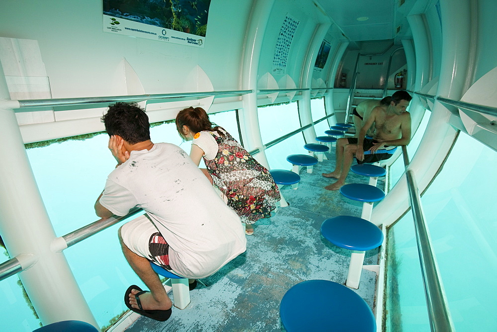 Tourists on a semi submersible, viewing the Great Barrier Reef off Cairns in Queensland, Australia, Pacific