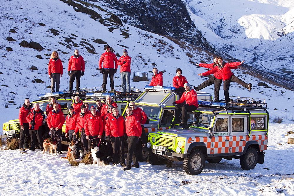 The Langdale Ambleside Mountain Rescue Team pose for a team photo in Langdale in the Lake District, Cumbria, England, United Kingdom, Europe