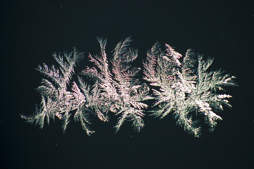 Ice crystals on a car windscreen in cold temperatures