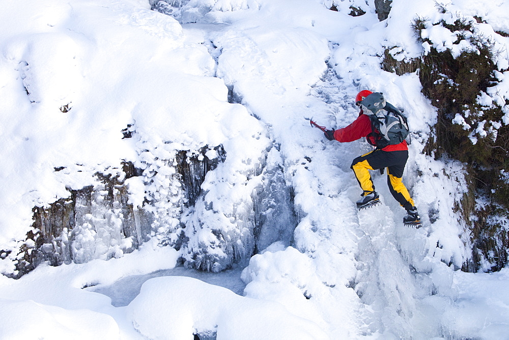 The mountaineer, Mike Withers, ice climbing in Fisher Place gill above Thilrmere in the Lake District, Cumbria, England, United Kingdom, Europe