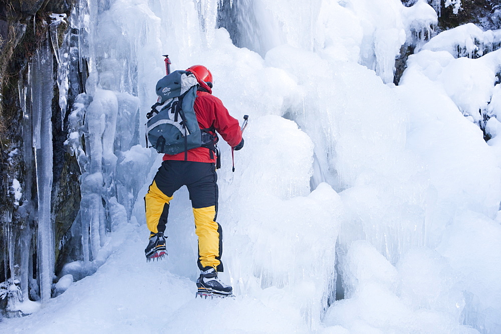 The mountaineer, Mike Withers, ice climbing in Fisher Place gill above Thilrmere in the Lake District, Cumbria, England, United Kingdom, Europe