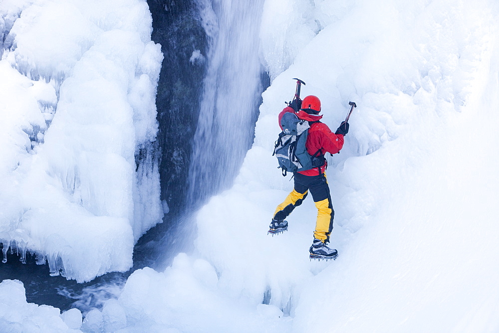 The mountaineer, Mike Withers, ice climbing in Fisher Place gill above Thilrmere in the Lake District, Cumbria, England, United Kingdom, Europe