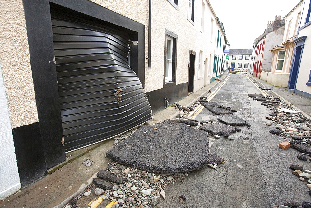 Tarmac ripped up by the power of the flood water in November 2009, Cockermouth, Cumbria, England, United Kingdom, Europe