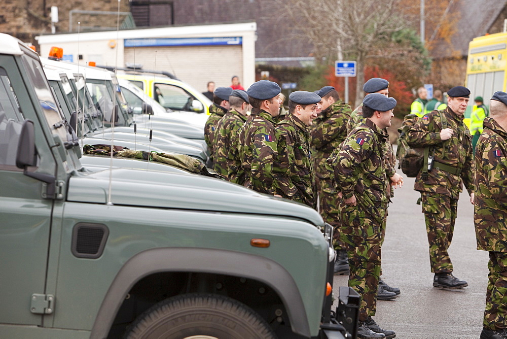 Soldiers called up to help with the clear up near Cockermouth Main Street on Saturday morning after the floodwaters had receded, Cumbria, England, United Kingdom, Europe