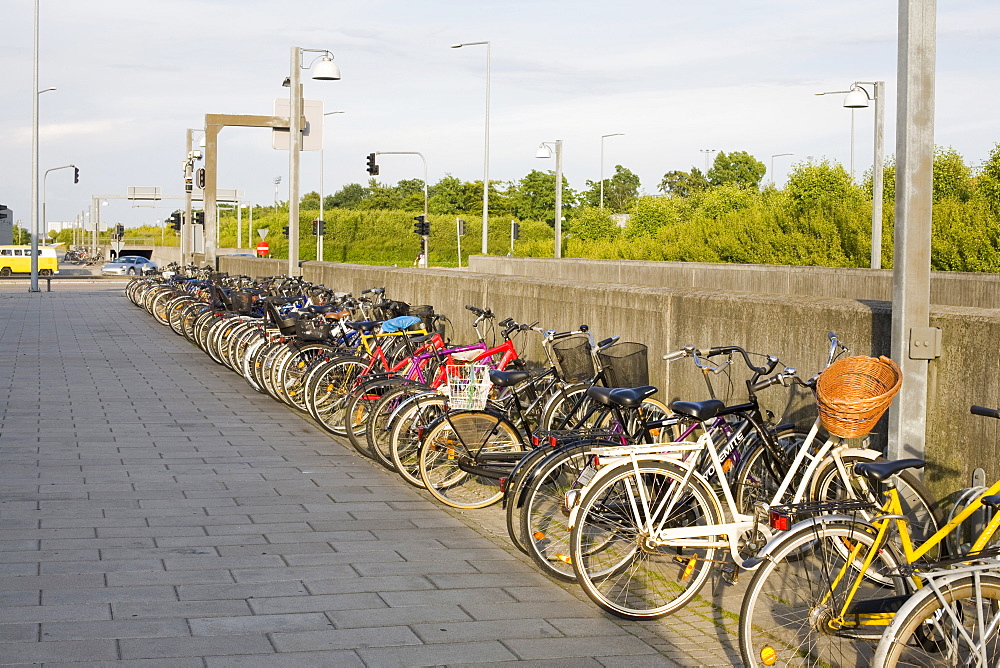 Bicycles parked outside a railway station on the outskirts of Copenhagen in Denmark, Scandinavia, Europe