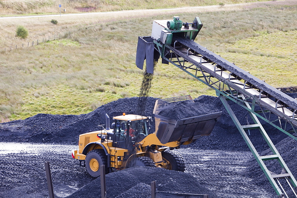 A conveyor belt taking coal from the Glentaggart open cast coal mine to a roadhead for onward transport by road in Lanarkshire, Scotland, United Kingdom, Europe