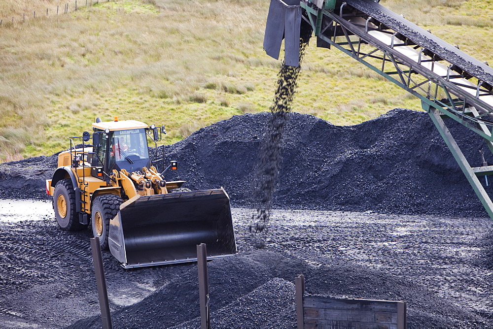 A conveyor belt taking coal from the Glentaggart open cast coal mine to a roadhead for onward transport by road in Lanarkshire, Scotland, United Kingdom, Europe