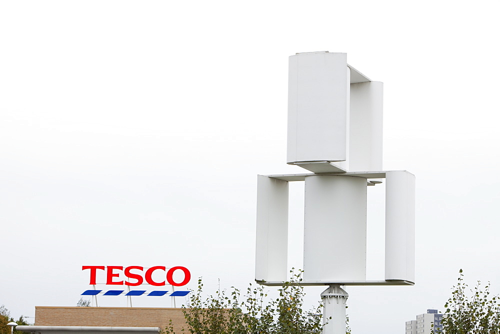 A vertical axis wind turbine in the grounds of a Tesco supermarket in Oldham, Lancashire, England, United Kingdom, Europe