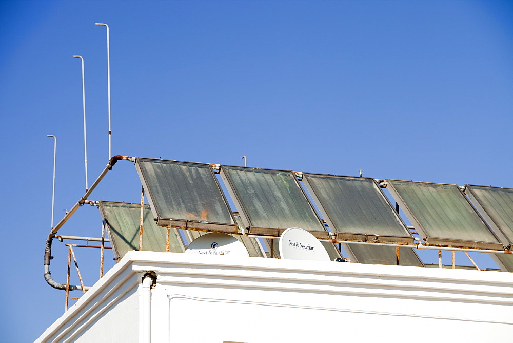 Solar water heating panels on the roof of a launderette in Teos, Turkey, Eurasia