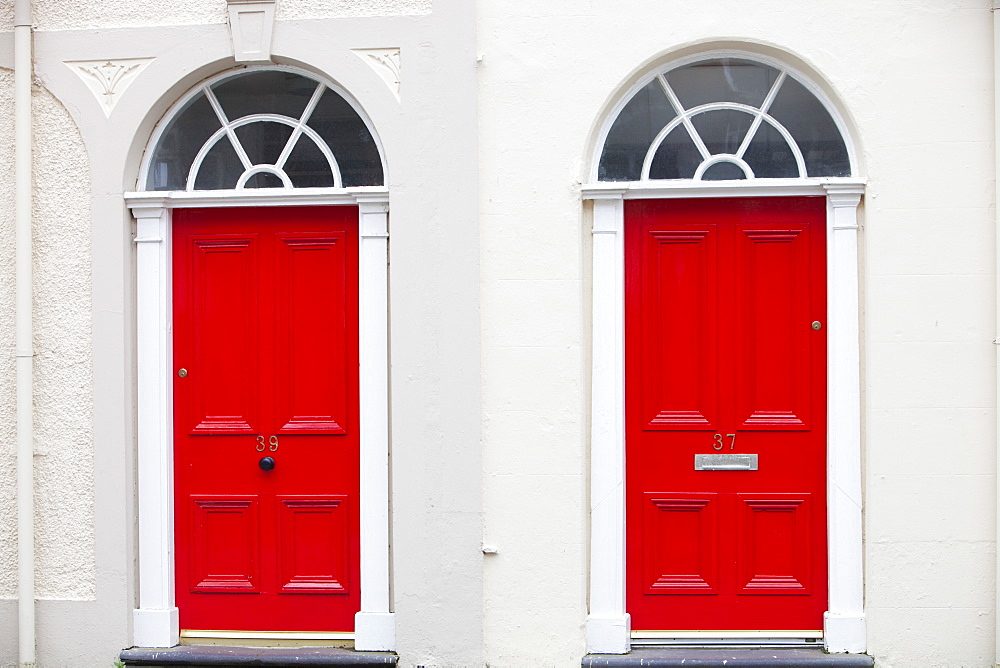 Red front door in a university building in Bangor, North Wales, United Kingdom, Europe