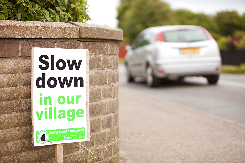 A sign asking motorists to slow down in Mundesley village in Norfolk, England, United Kingdom, Europe