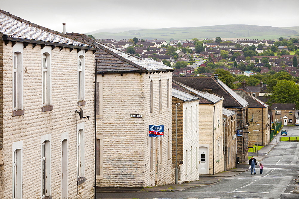 Boarded up terraced houses that have been compulsorily purchased for demolition in the Burnley Wood area of Burnley, Lancashire, England, United Kingdom, Europe