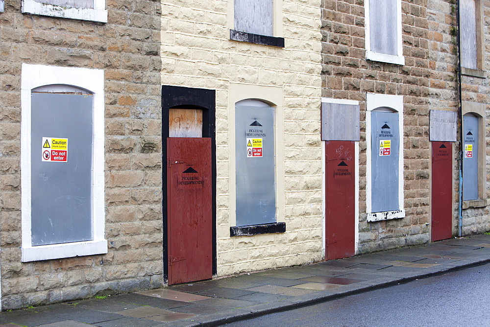 Boarded up terraced houses that have been compulsorily purchased for demolition in the Burnley Wood area of Burnley, Lancashire, England, United Kingdom, Europe