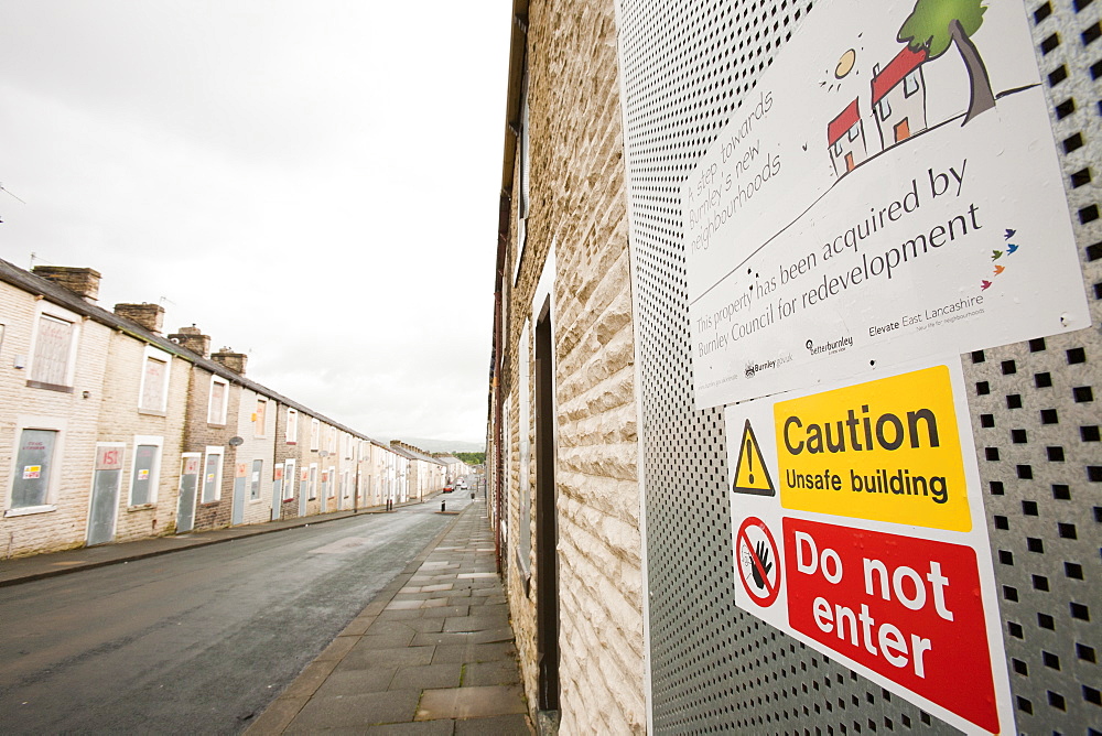 Boarded up terraced houses that have been compulsorily purchased for demolition in the Burnley Wood area of Burnley, Lancashire, England, United Kingdom, Europe