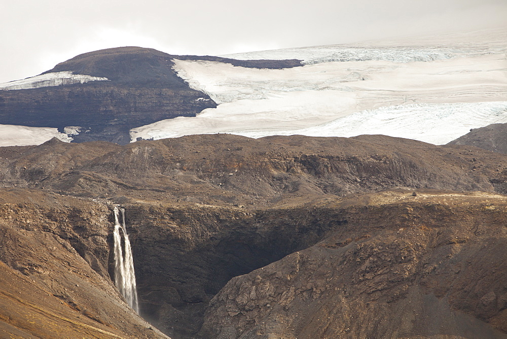 A waterfall fed by meltwater from the Langjokull icecap in Iceland, Polar Regions