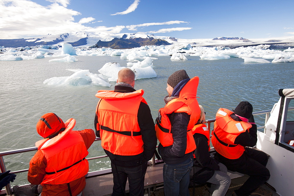 Tourists riding in an amphibious truck at the Jokulsarlon ice lagoon, one of the most visited places in Iceland, Polar Regions