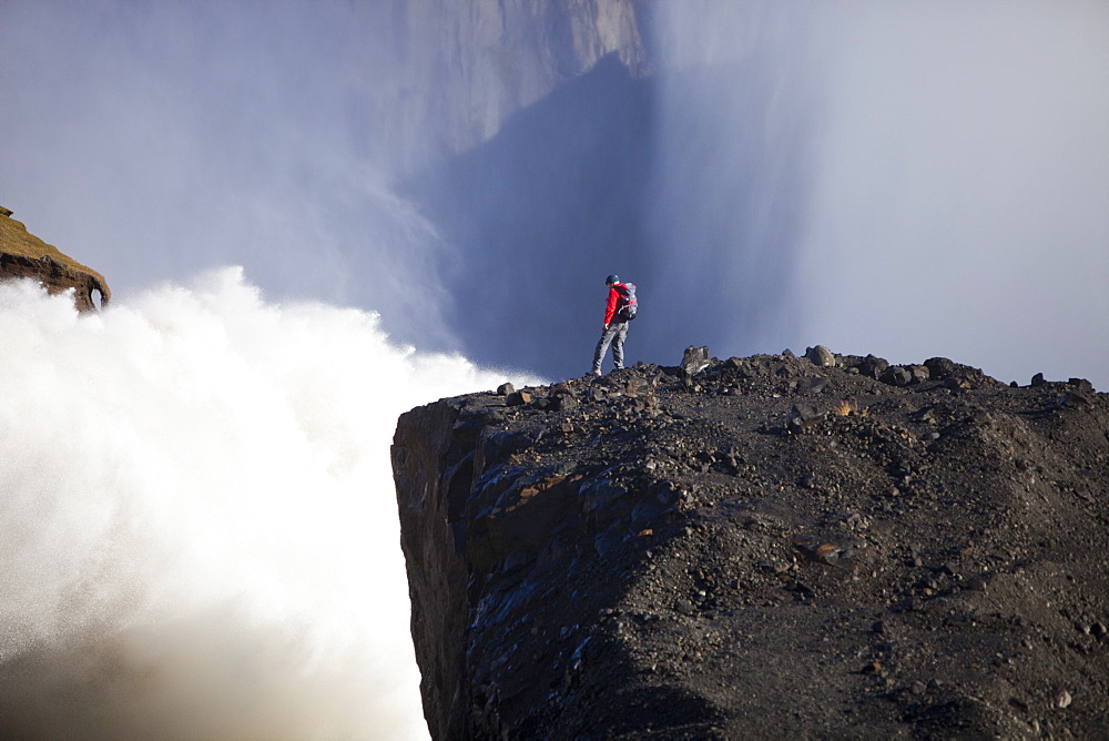 Mountaineer by the overspill from the Karahnjukar dam and Halslon reservoir, North East Iceland, Iceland, Polar Regions