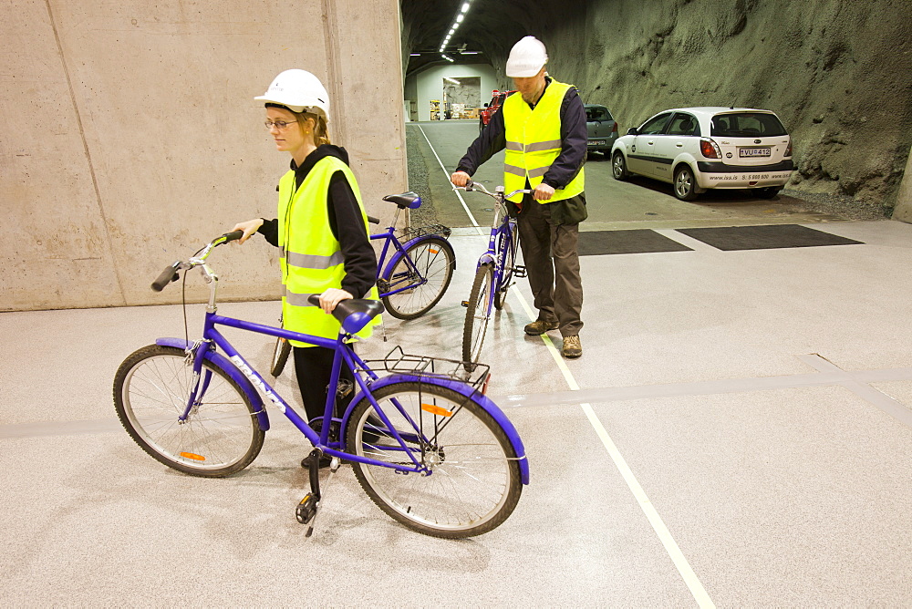 Workers use bicycles to get around the underground plant at the Fljotsdalur hydro power station part of Karahnjukar a massive new contorversial hydro electricity project in North East Iceland, Polar Regions