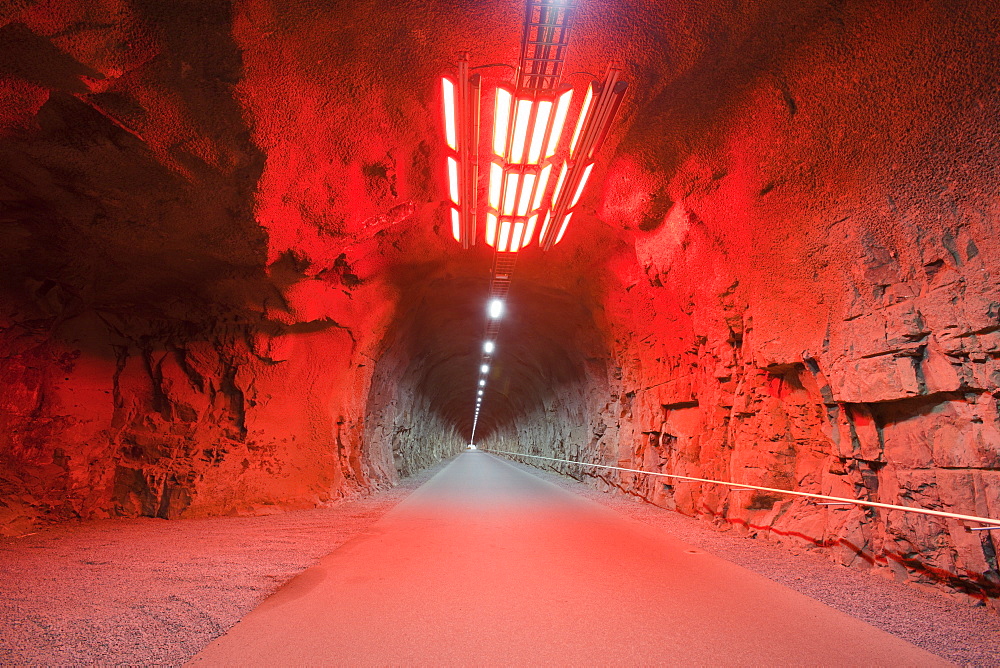 Red light art installation in the entrance tunnel to the underground Fljotsdalur hydro power station, part of Karahnjukar a massive new contorversial hydro electricity project in North East Iceland, Polar Regions