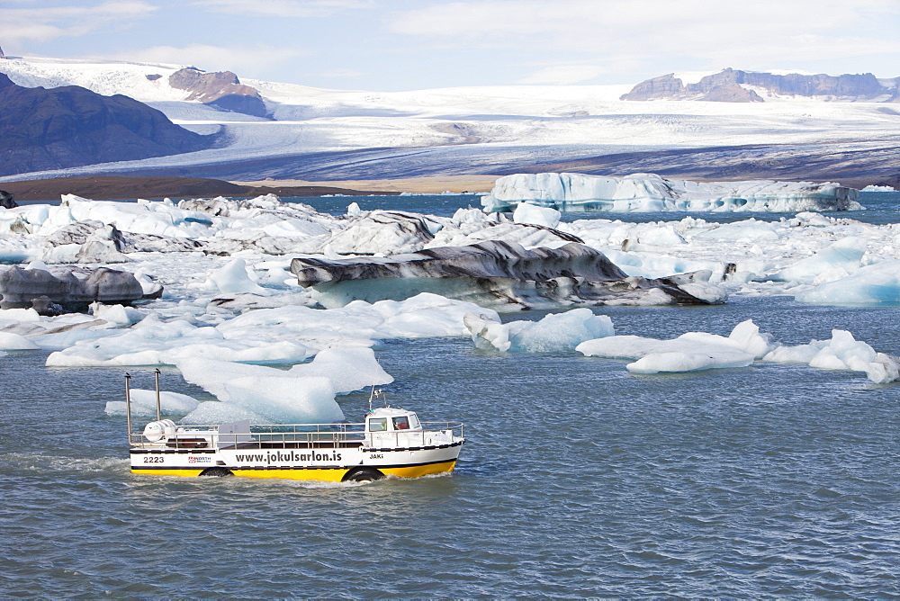 Tourists taking a boat trip to get close to the icebergs, Jokulsarlon ice lagoon, one of the most visited places in Iceland, Polar Regions