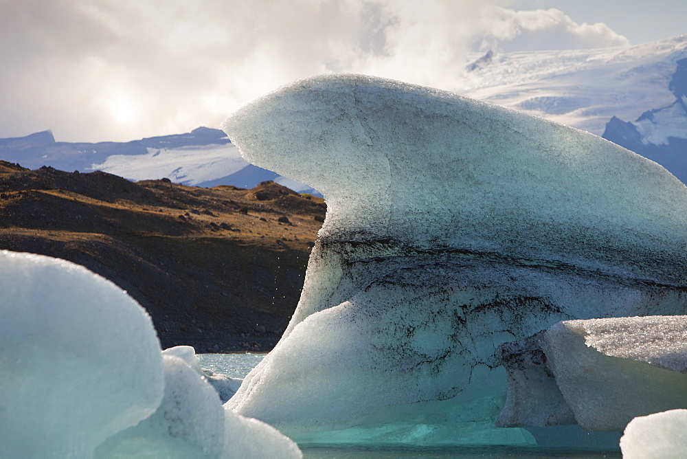 Water droplets drip from a melting iceberg at Jokulsarlon ice lagoon, one of the most visited places in Iceland, Polar Regions