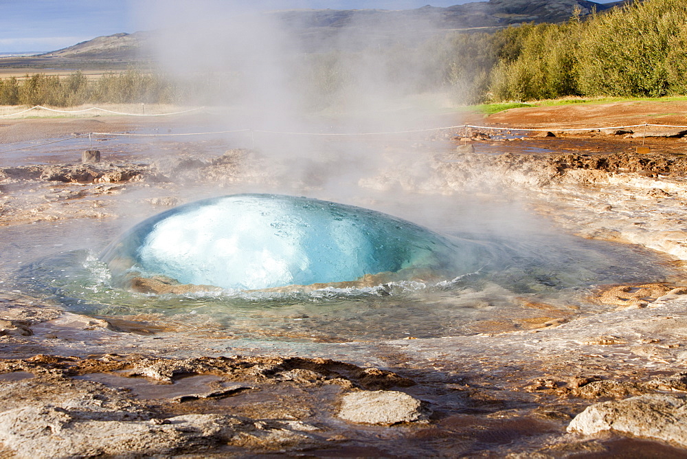 A Geysir a split second before its eruption at Geysir in Iceland, Polar Regions