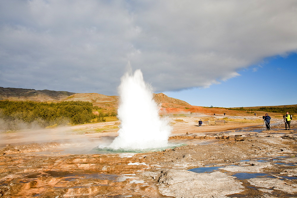 A Geyser erupting at Geysir in Iceland, Polar Regions