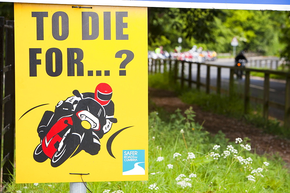 A sign warning motorcyclists of dangerous riding at Devils Bridge in Kirkby Lonsdale, Cumbria, England, United Kingdom, Europe