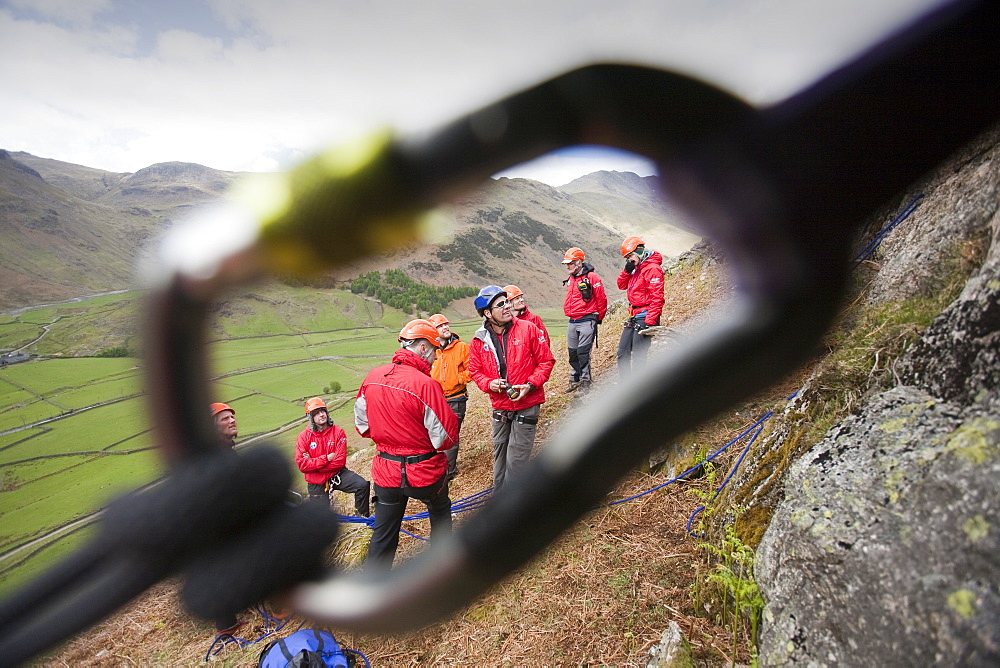 Members of the Langdale/Ambleside mountain Rescue setting up belays on a Team training in the Langdale Valley, Lake District,, United Kingdom.