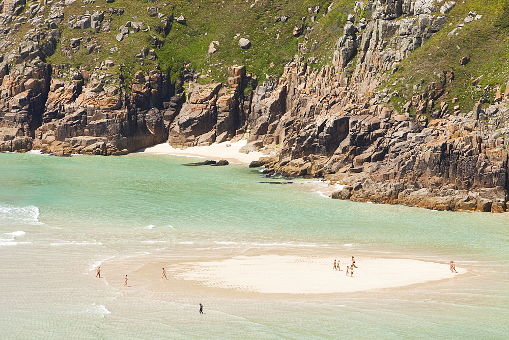 Nude bathers on a nudism beach at Porthcurno, Cornwall England, United Kingdom, Europe