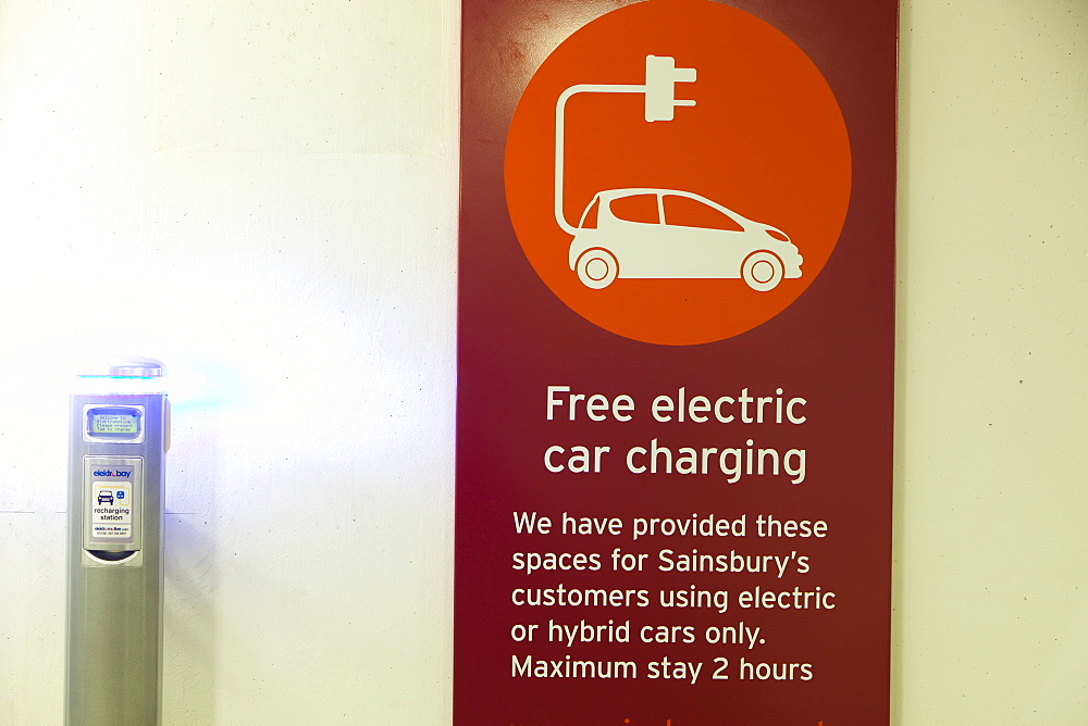 An electric vehicle charging station provided free of charge for customers at Camden Sainsbury's supermarket in London, England, United Kingdom, Europe