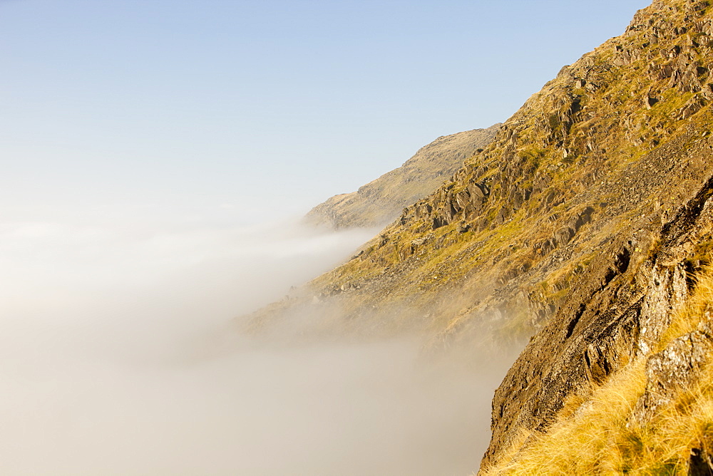 A temperature inversion with valley mist over Red Screes near Ambleside in the Lake District National Park, Cumbria, England, United Kingdom, Europe