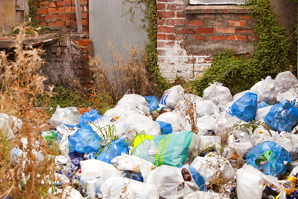 Rubbish piled high behind condemned houses in Barrow in Furness, Cumbria, England, United Kingdom, Europe