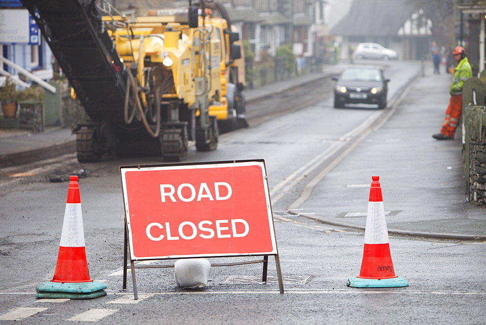 Resurfacing work in Ambleside after floods and harsh winter weather caused serious erosion of the road surface, Cumbria, England, United Kingdom, Europe