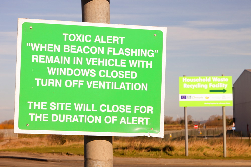 A warning sign about toxic air pollution outside a power from waste incinerator plant at Billingham on Teesside, England, United Kingdom, Europe