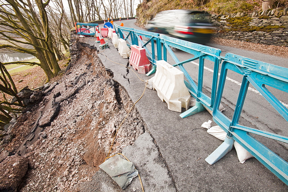 A large section of road collapsed betwwen Skelwyth and Elterwater in the Langdale Valley, Lake District, Cumbria, England, United Kingdom, Europe