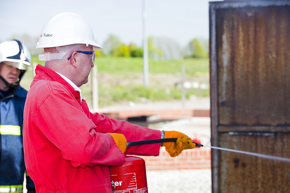 A fire fighting exercise as part of a BOSIET course for offshore workers, Billingham, Teesside, England, United Kingdom, Europe