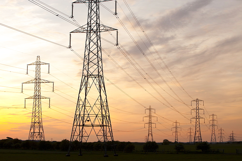 Power lines and pylons at sunset in Billingham, Teesside, England, United Kingdom, Europe