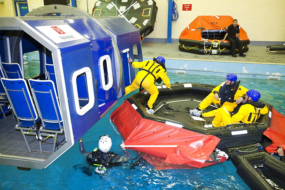 Workers in the offshore industry practise helicopter ditching evacuation as part of an industry training course, Billingham, Teesside, England, United Kingdom, Europe