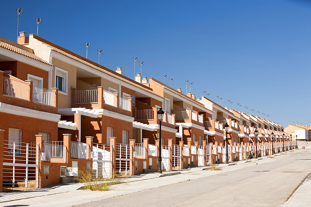 A new build housing development that was abandoned when the Spanish economy collapsed during the recession, causing the developer to become bankrupt, near Sanlucar La Mayor, Spain.