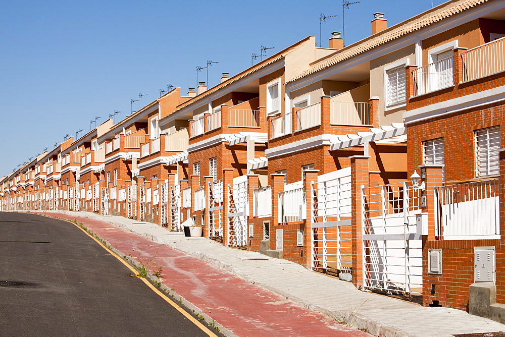 A new build housing development that was abandoned when the Spanish economy collapsed during the recession, causing the developer to become bankrupt, near Sanlucar La Mayor, Spain.