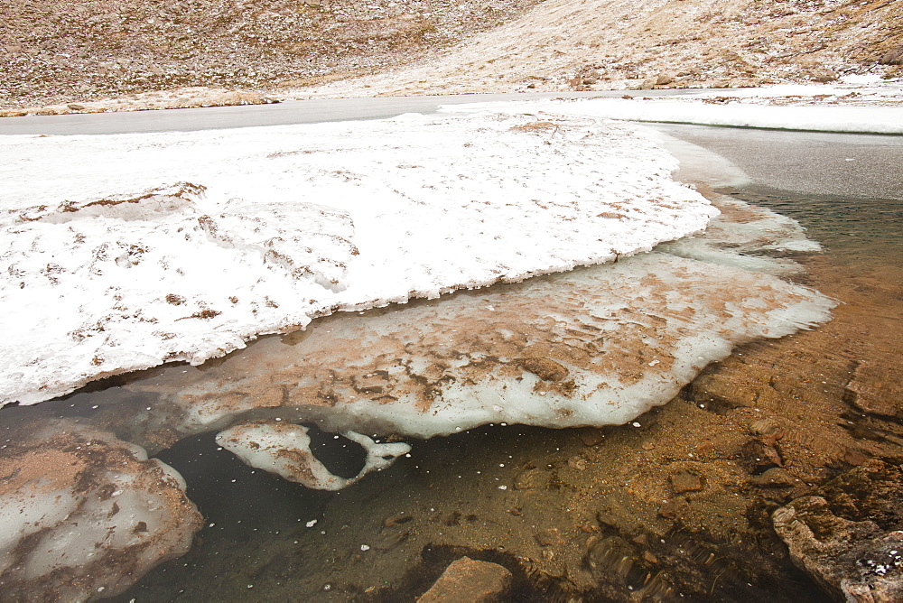 Avalanche debris and ice breaking up on Coire an Lochain, Cairngorms, Scotland, United Kingdom, Europe