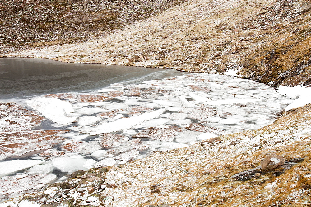 Avalanche debris and ice breaking up on Coire an Lochain, Cairngorms, Scotland, United Kingdom, Europe