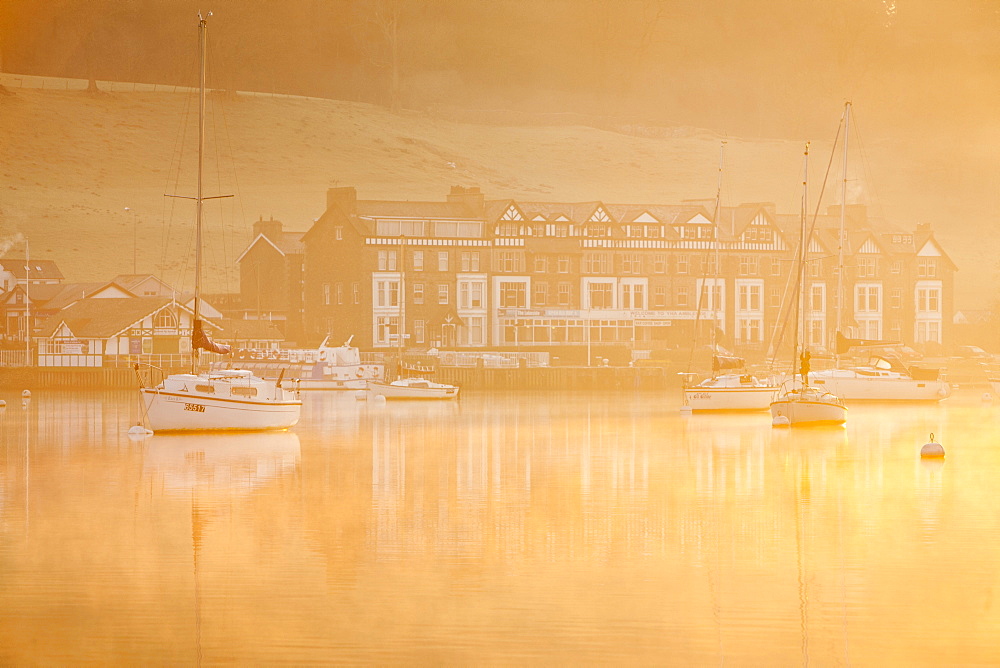 Sailing boats at dawn on Lake Windermere at Waterhead, Ambleside in the Lake District National Park, Cumbria, England, United Kingdom, Europe