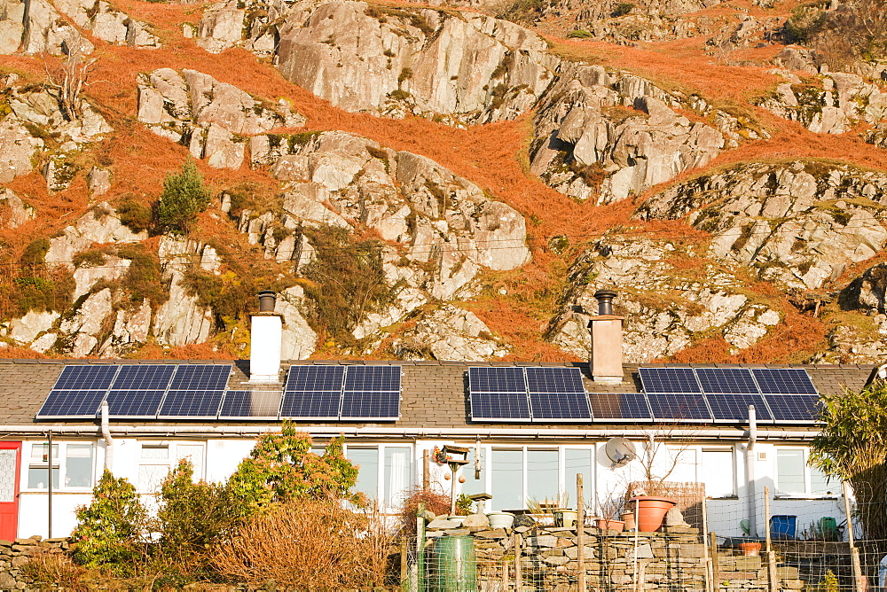 Solar panels on Council houses in Chapel Stile in the Langdale Valley, Lake District, Cumbria, England, United Kingdom, Europe