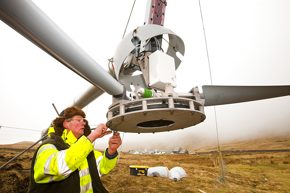 Three wind turbines being constructed behind the Kirkstone Pass Inn on Kirkstone Pass in the Lake District, Cumbria, England, United Kingdom, Europe