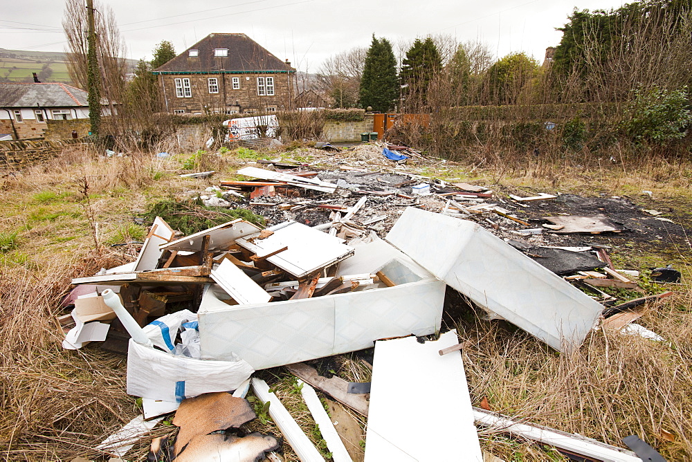 Rubbish dumped on waste ground in Keighley, West Yorkshire, Yorkshire, England, United Kingdom, Europe